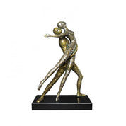 dancers gold sculpture