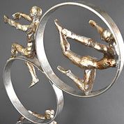 three acrobats gold modern sculpture